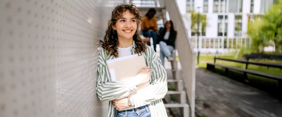 College student holding books